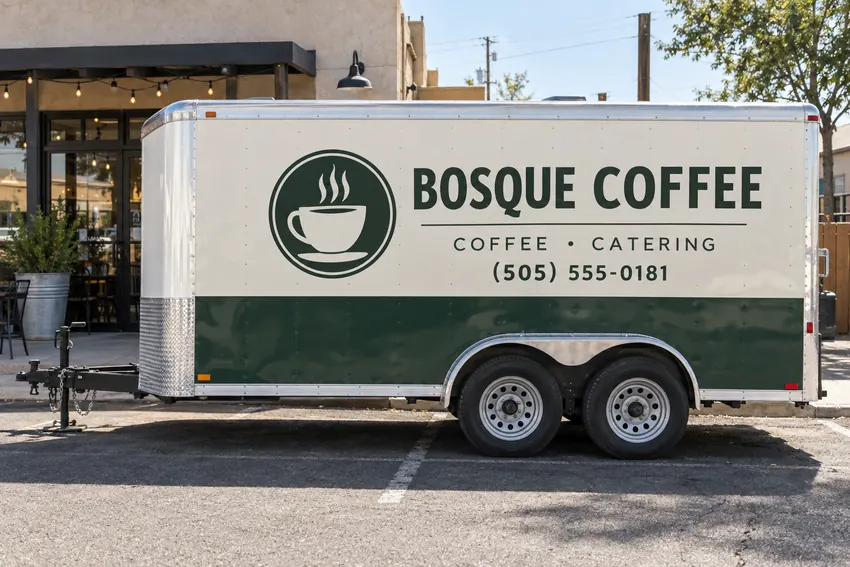 Bosque Coffee trailer with forest-green and cream branding