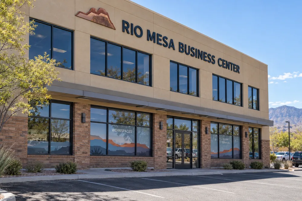 Two-story Rio Mesa Business Center with coordinated window graphics across multiple ground-floor panes